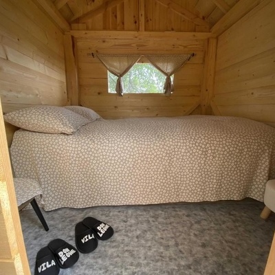 This bungalow comes with a bedroom, a seating area and a bathroom.