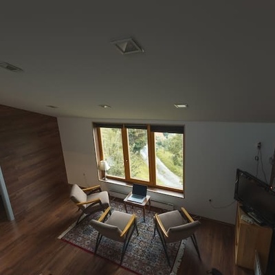 A comfortable living area with a loft bedroom for a restful stay.