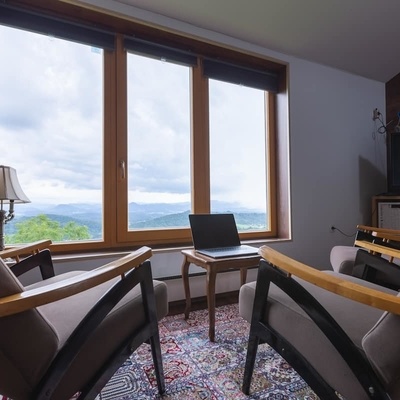 The accommodation features a panoramic window offering exceptional views of the landscape.
