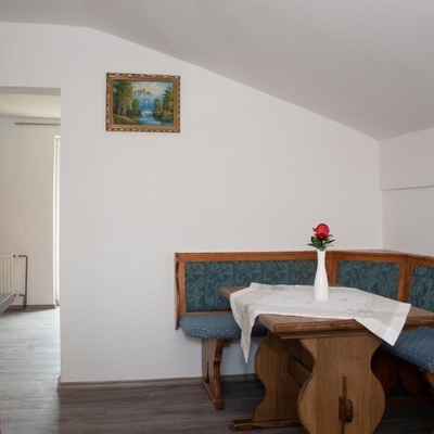 The kitchen in the apartment includes a dining nook.