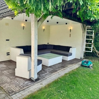 The terrace is spacious with comfortable furniture.