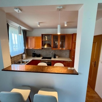 The kitchen is spacious and bright.