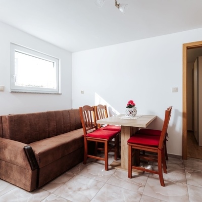 The kitchen includes a dining area.