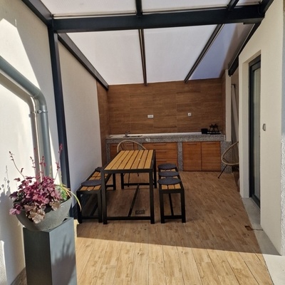 In warm weather, meals can be prepared in the summer kitchen.