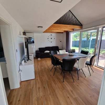 The dining area and living room have direct access to the terrace.