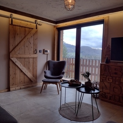Enjoy the view from the balcony or from the panoramic window.