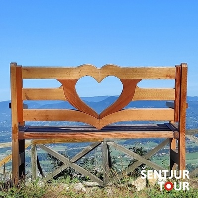 At the viewpoint on Rifnik, you can rest on the “bench of love.”