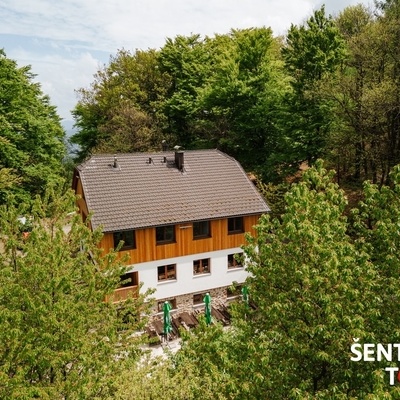 The lodge is located slightly below the peak on the southern side of Resevna hill (682 m).