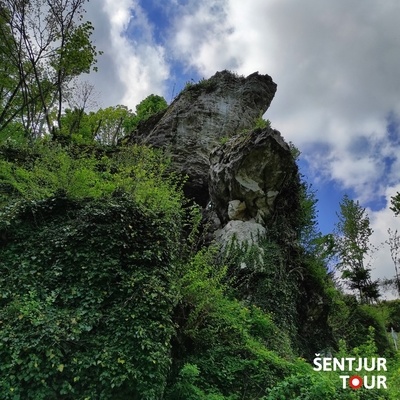 The megalith stands on a larger rock that is steep and nearly inaccessible from below.